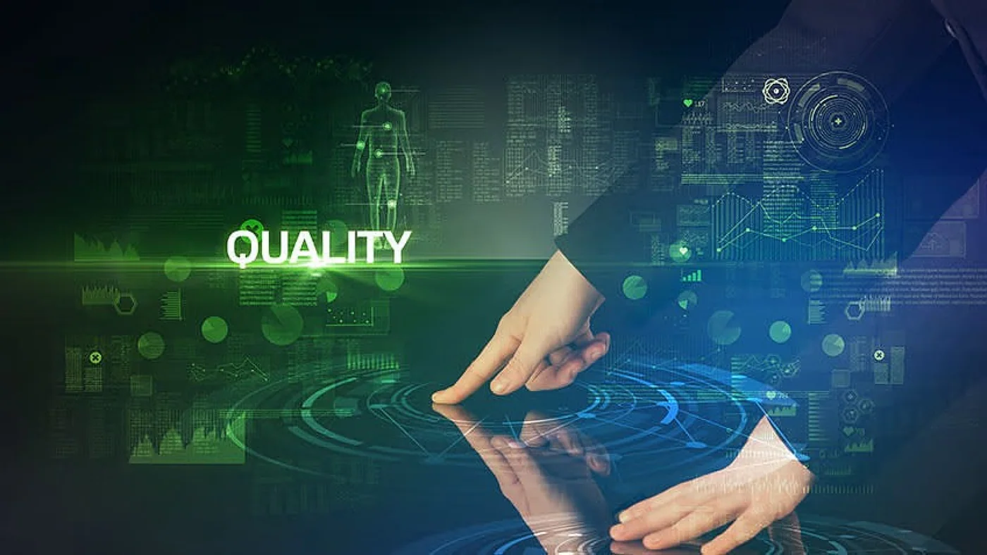 Hand touching a digital interface labelled Quality
